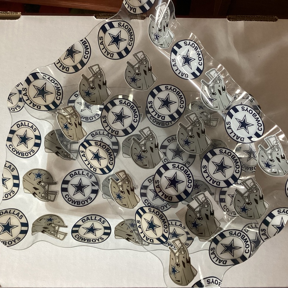 Set of 2 scolloped light plastic Dallas Cowboy trays 10” by 7” by 1 1/2” deep
